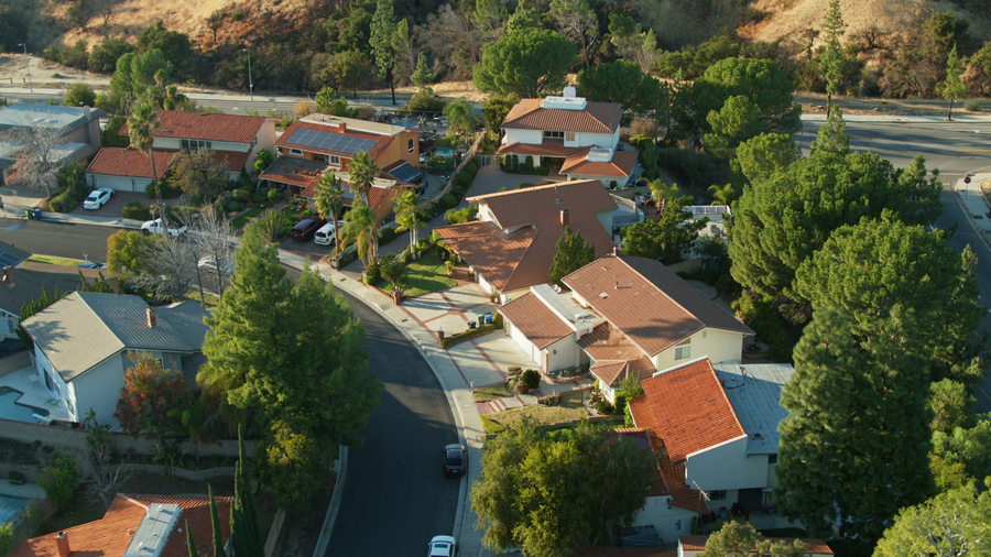 Aerial drone still showcasing suburban track housing in the San Fernando Valley's Porter Ranch neighborhood in Los Angeles.
